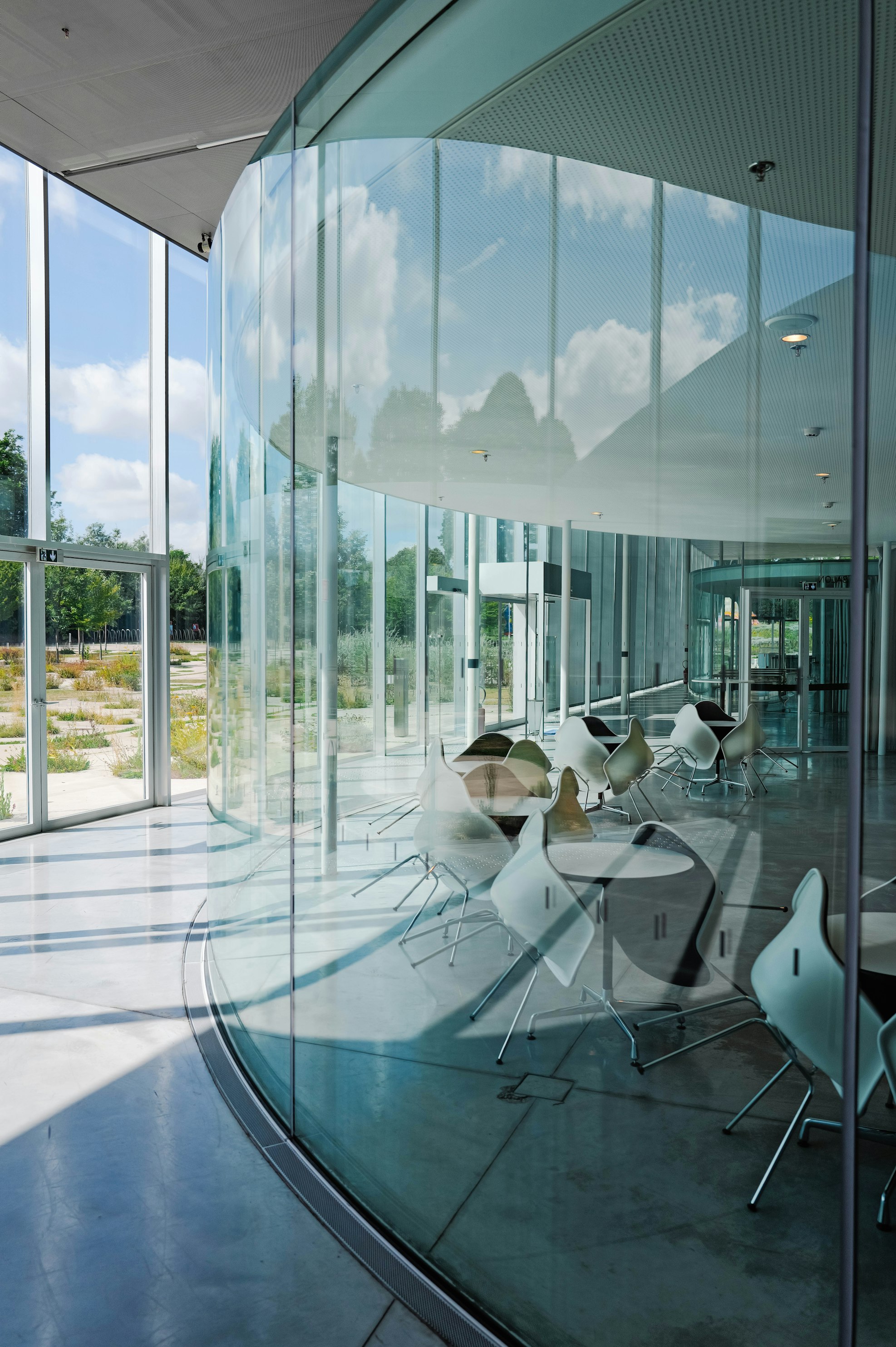 Minimalist office with glass partitions